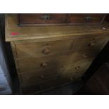 A Victorian pine chest of two short and three long graduated drawers, on tapered legs, 109 x 94.