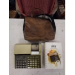 A vintage Hewlett Packard 97 calculator with hand book and original carry case Location: 8:3