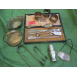 A mixed lot of silver to include a decanter label, sugar tongs and napkin rings Location: Porter