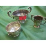 Three items of silver to include a small early 20th Century twin handled Sunbury Regatta trophy