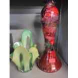 An Art glass table lamp, signature indistinct, in a red and black mottled effect A/F (requires re-