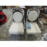 A pair of vintage French white painted wrought metal armchairs with off white upholstery Location: G