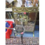 An early 20th century brass and mirrored fire screen together with a Victorian cast iron trivet on