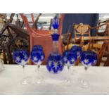 A German Bleikristall blue overlaid crystal decanter with six matching wine glasses Location: 7:1