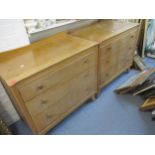 A pair of oak finished chest of three graduated drawers with raised backs Location: RWM