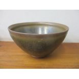 A Chinese pottery treacle brown and black glazed bowl 7cm h x 12.5cm w