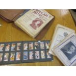 A cigarette album to include mixed cards, film stars including Garry Cooper, Marlene Dietrich and