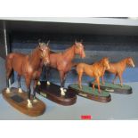 A group of four Beswick and Royal Doulton models of the racehorses, Nijinsky and Lammtarra