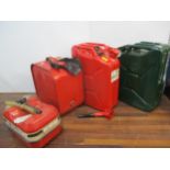 Four metal oil/petrol cans to include a JC20 red Jerry Can Location: G