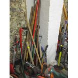 A quantity of various garden tools to include a Black & Decker 380W electric hedge trimmer, wooden