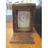 A late 19th/early 20th century carriage clock in a fitted travelling case, clock measures 14cm