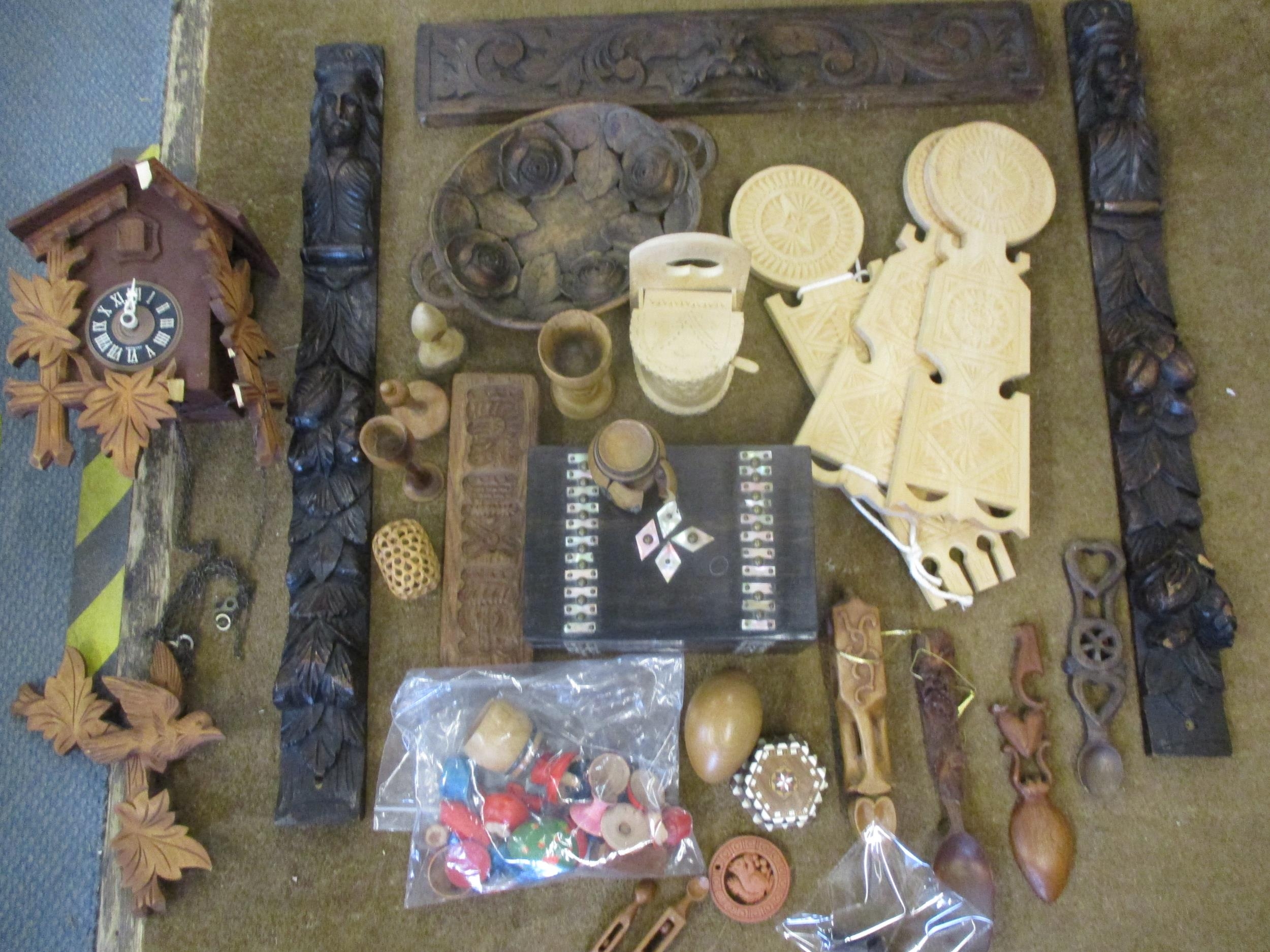 Mixed treen to include carved oak panels, Welsh spoons and a cuckoo clock Location: RWB