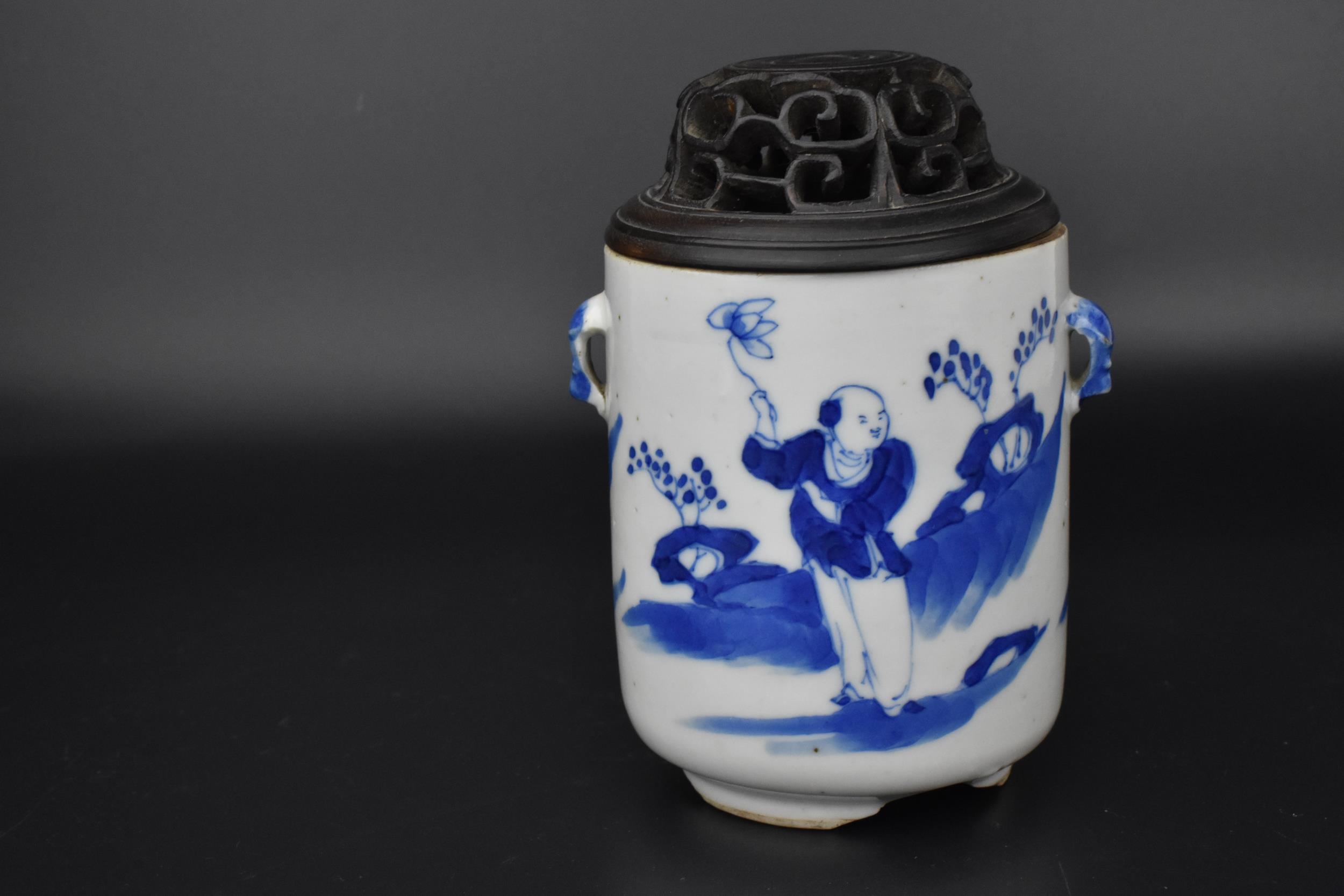 A Chinese Kangxi blue and white porcelain twin handled lidded censer, the body depicting scholars in - Image 2 of 4