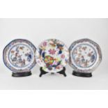 Three late 18th century Chinese plates in polychrome enamels, comprising one decorated in the