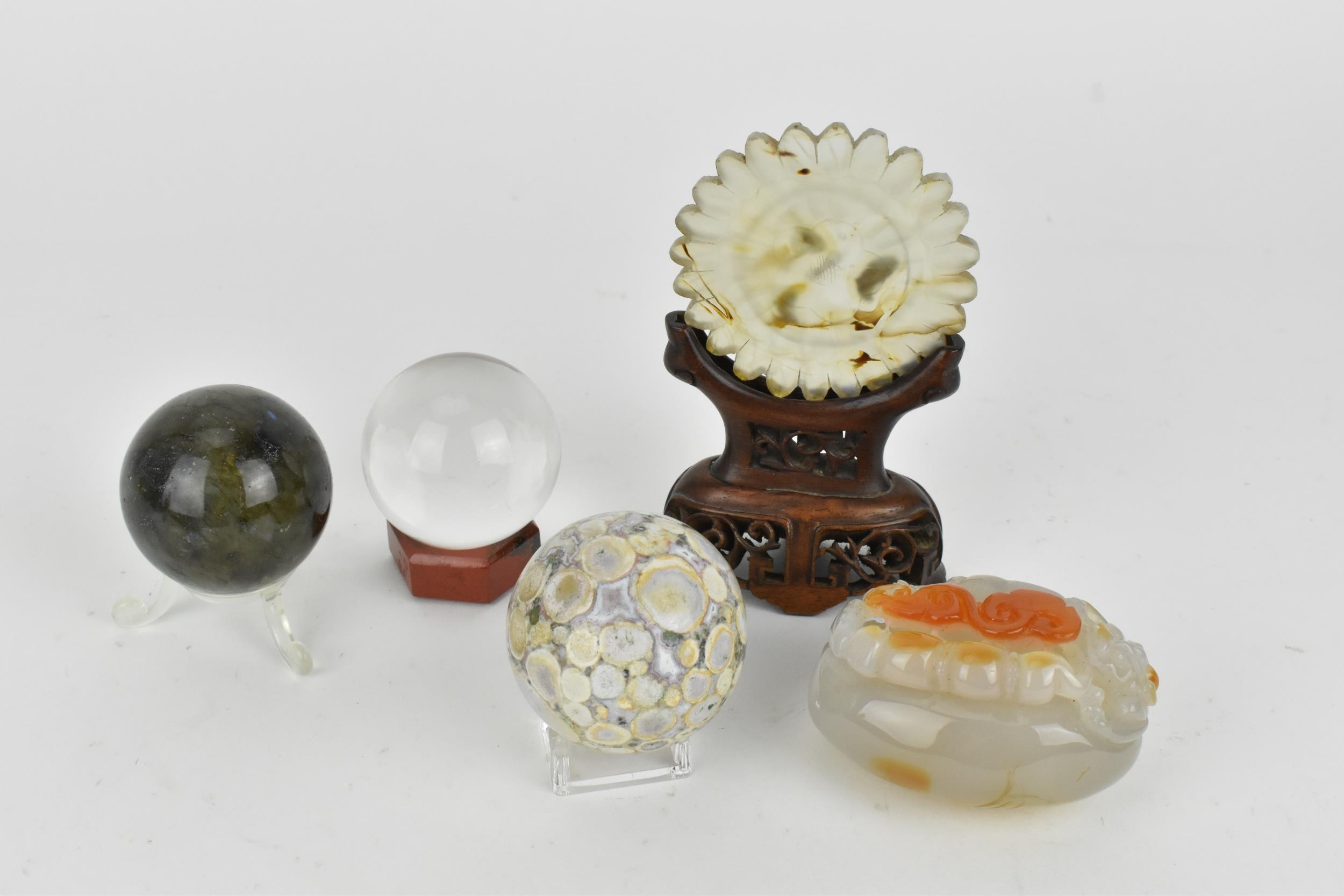 A Chinese carved agate decorative piece modelled with a dragon and scroll to the top and leaf detail