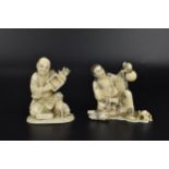 Two Japanese Meiji period ivory okimono, each modelled as a street performer with mice, one with a