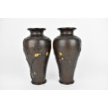 A pair of Japanese Meiji period patinated bronze vases, of tapered form with naturalistic relief