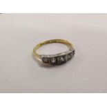 An 18ct gold and platinum ring set with five diamonds 2.9g Location: Cabs