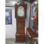 A late 18th/early 19th century mahogany cased 8-day long case clock having a painted arched top dial