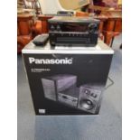 A Panasonic CD stereo system model number SC-PMX82EB-K, with original box Location: Rostrum