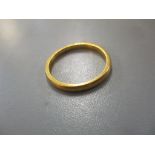 A 22ct yellow gold wedding band, weight 2.2g