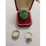 A 9ct gold and silver ring, together with a silver gilt ring set with jade style cabochon, and one