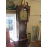 A George III oak cased 8-day long case clock having a broken swan neck pediment and fluted