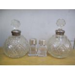 Four glass and silver scent bottles comprising two pairs