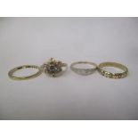 Four 9ct gold rings to include two wedding bands, and another set with sapphires, 7.2g
