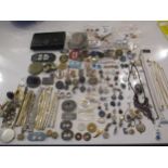 An interesting lot to include shoe buckles, silver coloured and white metal pendants, brooches,