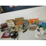 A mixed lot of cameras and accessories to include a boxed The Singer Polaroid land camera model