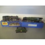 Two boxed 00 gauge Hornby engines to include a 80054 and a Duchess of Montrose with carriage
