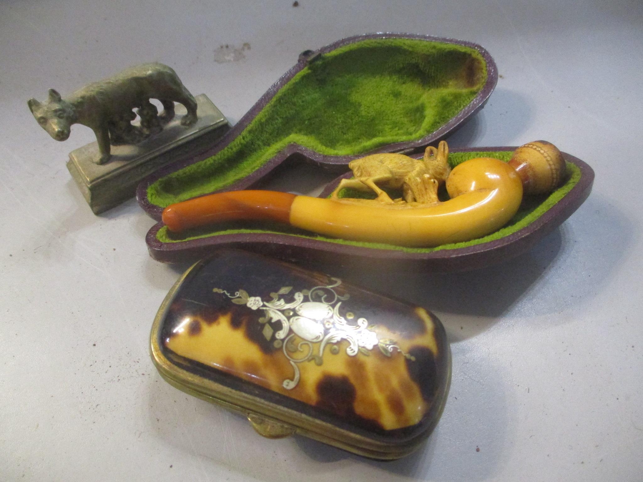 A late 19th century Meerschaum carved pipe in a case together with a tortoise shell box and a