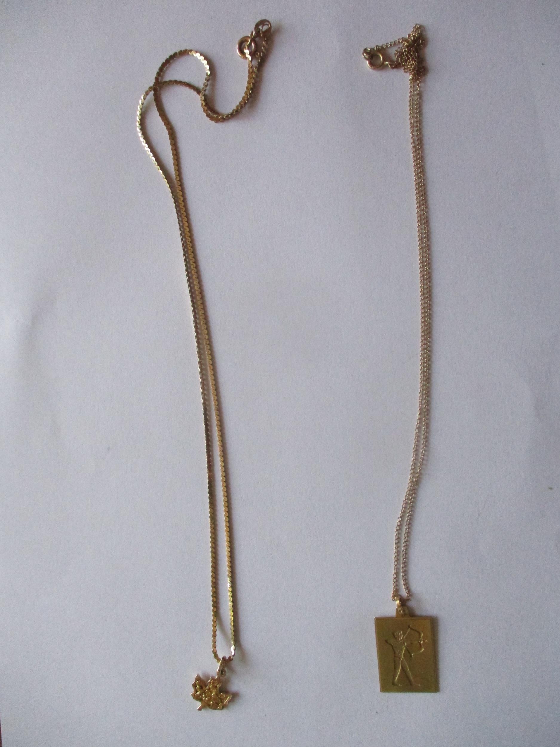 A 14ct gold necklace with 14ct gold pendant in the form of a Canadian maple leaf, 5.2g, together