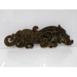 A Chinese dark green jade coloured plaque fashioned as a dragon, 24cm long