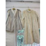A vintage arctic rabbit fur knee length coat with peplum sleeves, 40" chest x42" long, together with