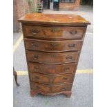 An early 20th century walnut veneered serpentine fronted chest of six drawers, 107cm x 59.5cm w