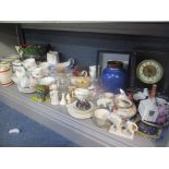 A mixed lot to include crested china, Winnie the Pooh prints, mantel clock, Wade decanters and other