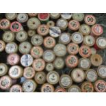 A collection of vintage wooden cotton reels to include Sylko, Chain, Coats, Clark & Co and Anchor,