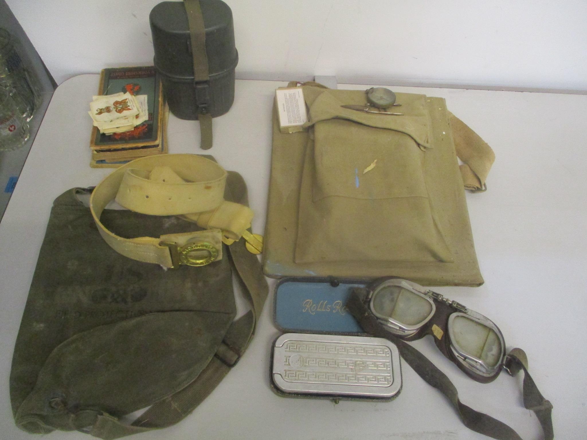A mixed lot to include a British Army white parade belt a US field protective mask M9A1 bag, leather