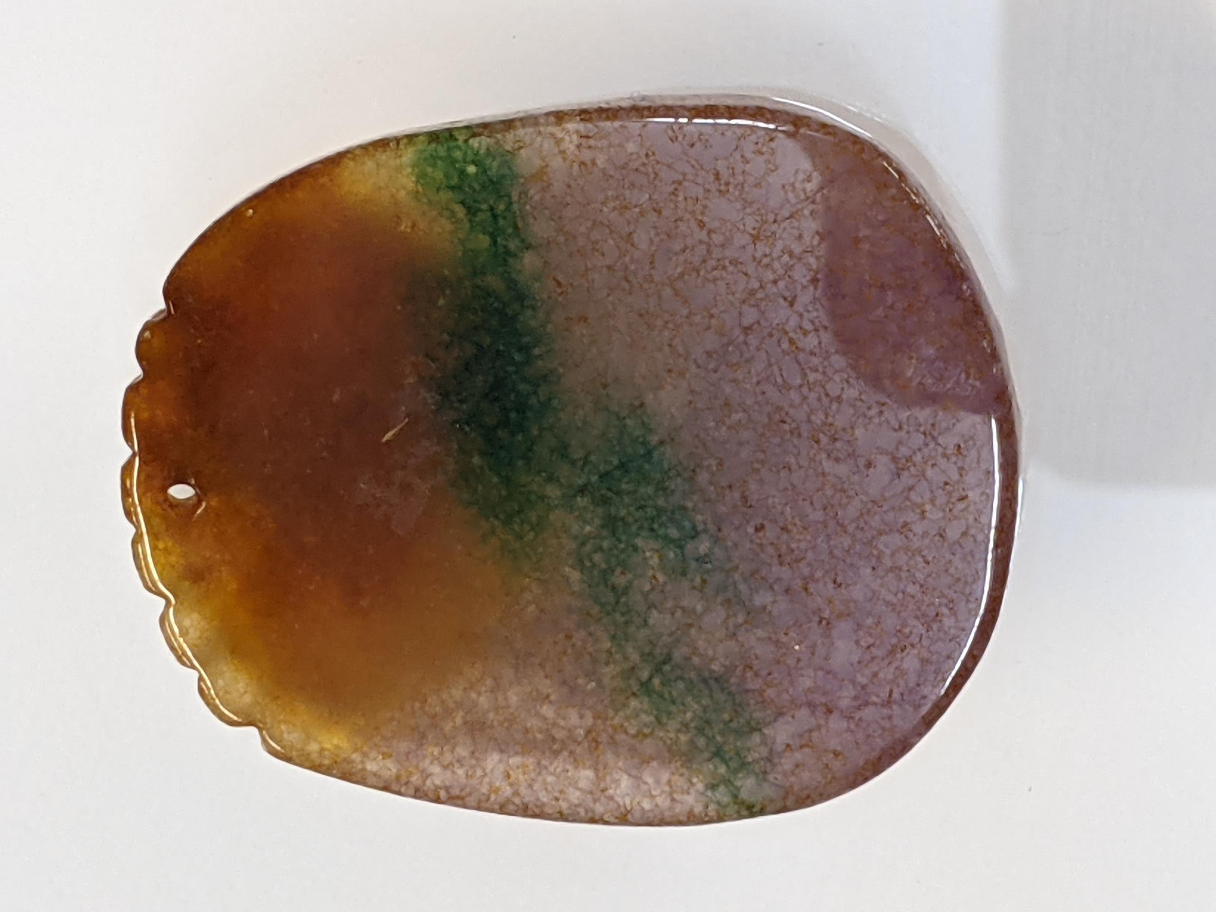 A Chinese pink, green, brown jade pendant carved with a child, fruit and a monkey, 5cm x 4cm - Image 2 of 2