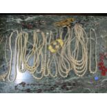 A small quantity of vintage costume jewellery to include multi-string pearl necklaces, A/F, a