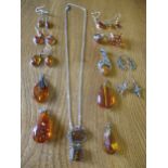 Mixed amber and silver earrings and pendants together with amber effect examples, a silver and amber
