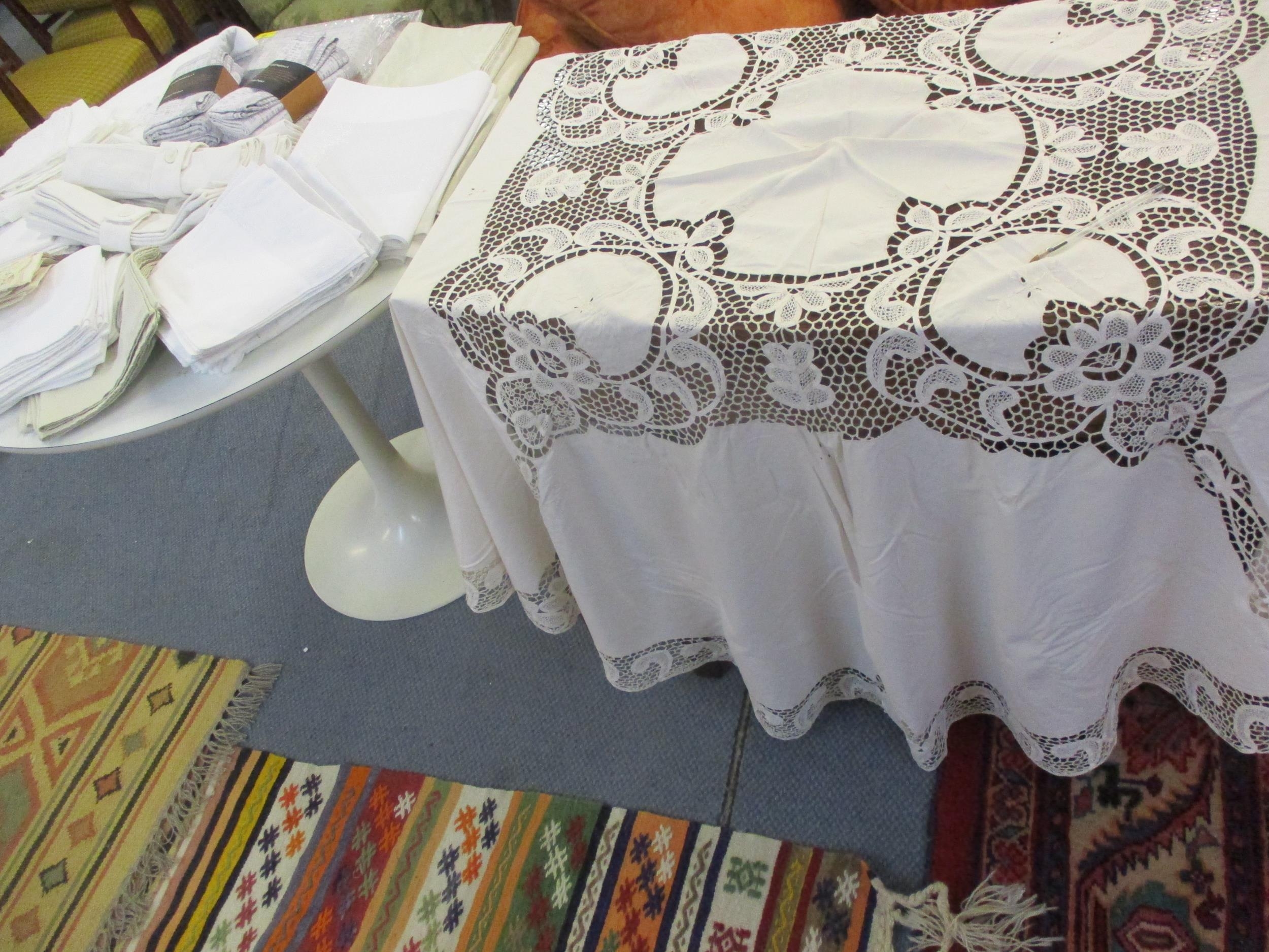 A quantity of mainly John Lewis table linen to include an un-opened Design Project tablecloth and