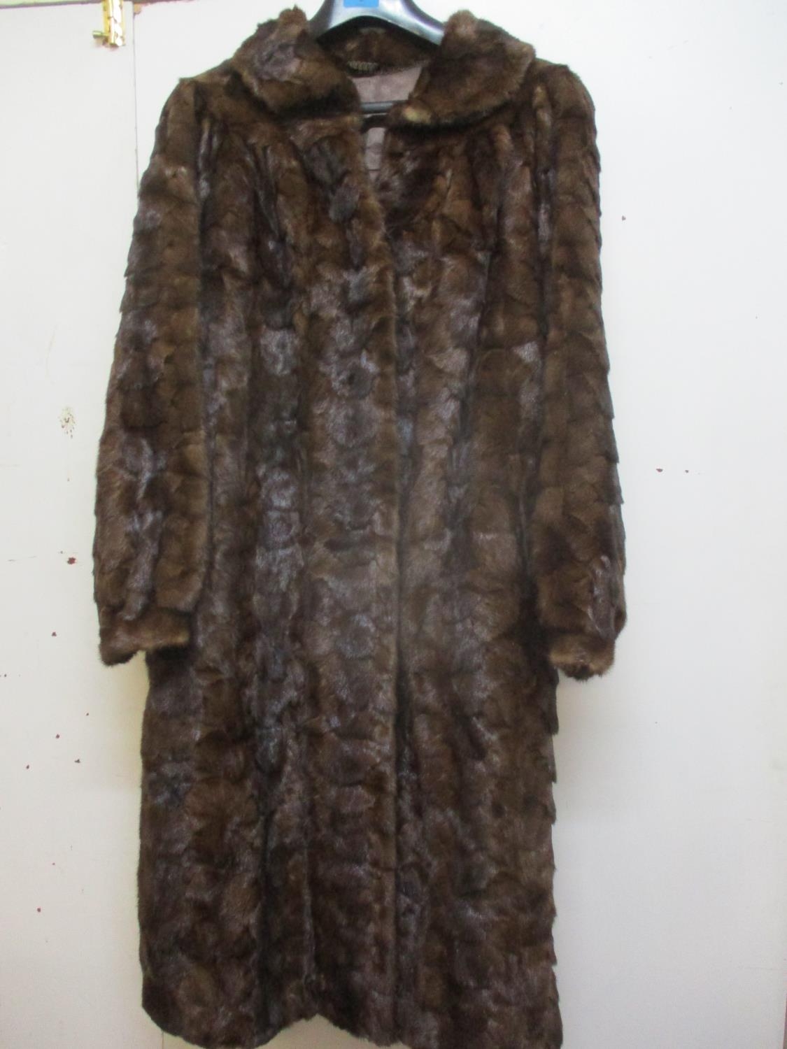 A Saga Scandinavian brown mink coat, purchased from Greece in the 1980's, 40" chest x 42" long, with