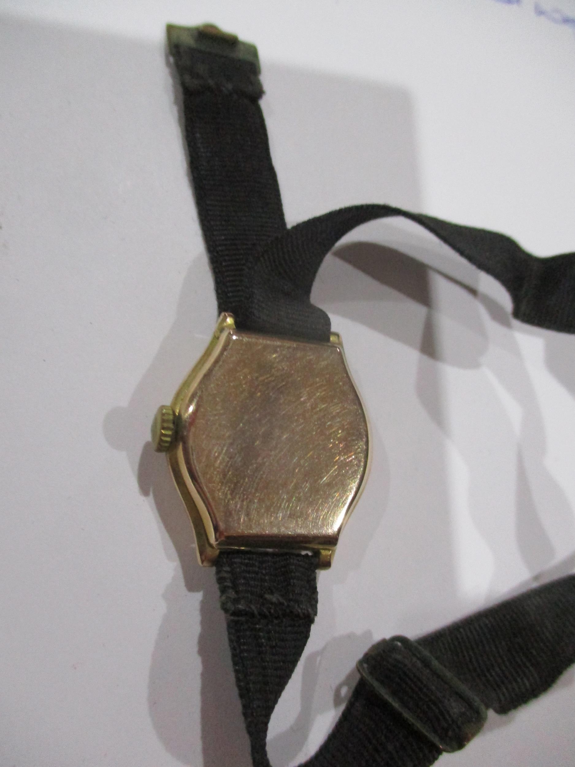 A ladies gold cased wristwatch, 9ct with ribbon bracelet, total weight 11.35g Location: CAB - Image 2 of 2