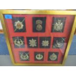 A group of ten WWII Scottish cap badges, each mounted on Scottish family tartan and mounted in a