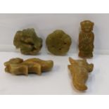 Five Chinese green/brown jade coloured pendants in the form of animals, a figure and others