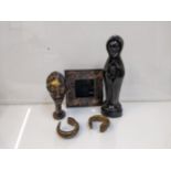 African related items to include two slave bracelets, a carved ebony figure and cast metal head