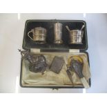 Silver to include a three piece condiment set, a baby rattle, a page marker, a vesta case and a